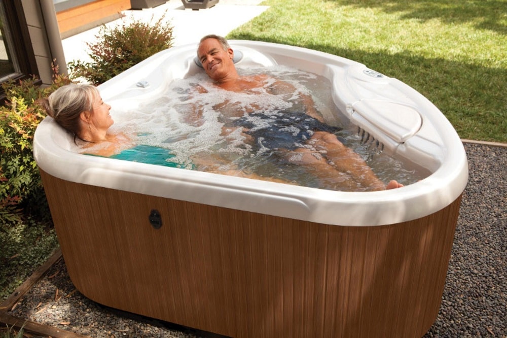 Senior couple enjoying a relaxing soak in a hot tub